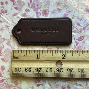 COACH burgundy Leather Tag - Embossed Logo